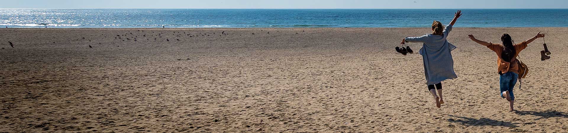 Girls running on the beach